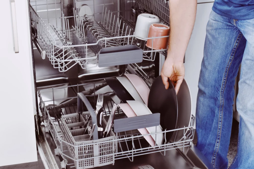 midsection of man loading dishwasher 2022 11 08 08 11 45 utc